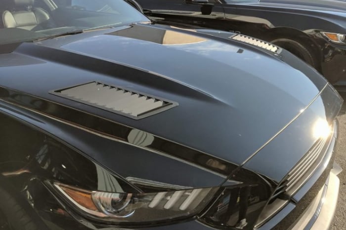 Aftermarket hood louvers on a Ford Mustang S550.