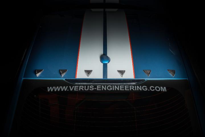 vortex silver generators displayed on top of blue and white striped car