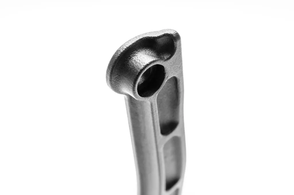 Close up of a 3D printed aluminum dogbone support plate